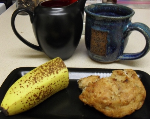 Starbucks coffee in a Radina's cup.  Half of an oatmeal and date scone from Whole Foods.  Yum!